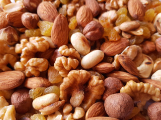 nuts background. Walnut, cashew, raisin, almond and hazelnut background texture