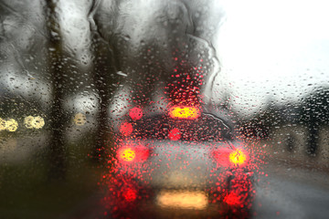 traffic in the city the first hours of the day, in the morning, with rain