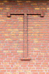 Brick wall with T letter
