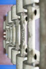 Rows of dumbbells in the gym. Dumbbell set. Many metal dumbbells on rack in sport fitness center. Top view