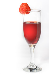 A glass of red wine with strawberries on a white background