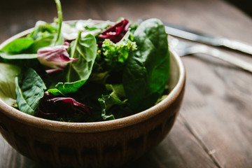 Green vegan Breakfast in a bowl with various leaves, top view. Clean eating, dieting, vegan schematic diagram of the food. selective focus