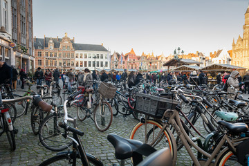 Naklejka premium Bicycles parking at Market Square (Grote Markt) in the historic center of Bruges, winter day, Brugge, West Flanders Belgium