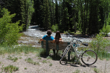 Couple man and woman bike and river