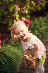 cute little girl smiling in a park close-up
