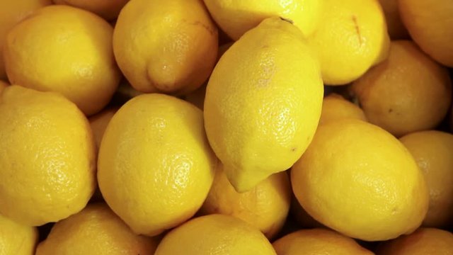 Colorful Display Of Lemons In Market