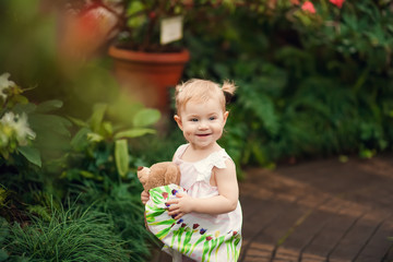 cute little girl smiling in a park close-up