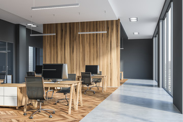 Gray and wooden open space office corner