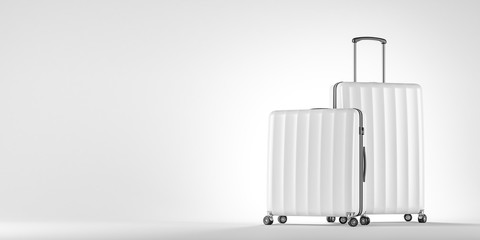 Two white suitcases on white