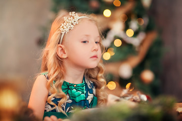Little child girl near Christmas tree/Happy new year