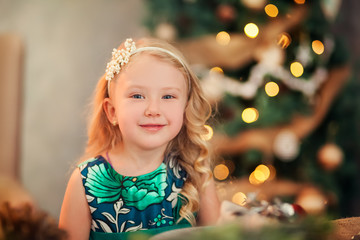 Little child girl near Christmas tree/Happy new year