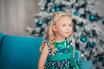 Little child girl near Christmas tree/Happy new year