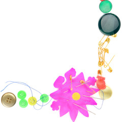 Colorful frame of buttons and needles. Free space for text.