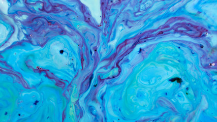 Closeup abstract color mixing of acrylic for use as background. Acrylic texture with marble pattern, marbling background 