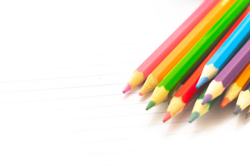 Colored pencils with light background. Back to school. School material for learning. Space for text