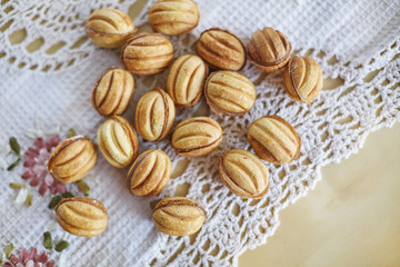 Traditional russian festive cookies in nut shape with caramelized milk inside