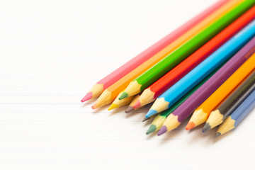 Colored pencils with light background. Back to school. School material for learning. Space for text