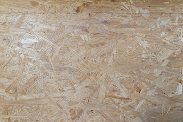 Close-up of the surface of a pressboard left in natural color