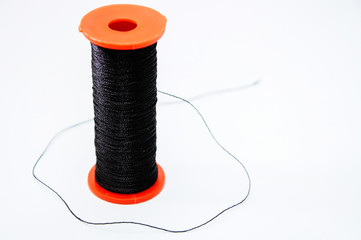 reel of black thread