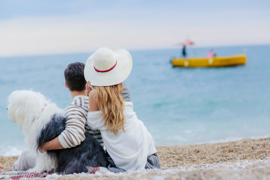 happy couple on the beach. Sea view with yellow boud