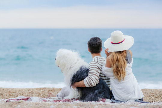happy couple on the beach. Sea view with yellow boud
