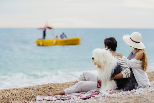 happy couple on the beach. Sea view with yellow boud
