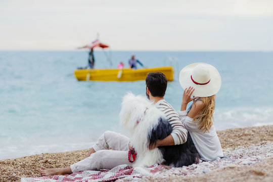 happy couple on the beach. Sea view with yellow boud