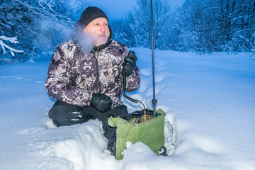 A man transmits messages by radio. Radio station with short waves. Hobby. VHF radio station....