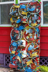 Repurposed bicycle wheels and paint cans  as an art display