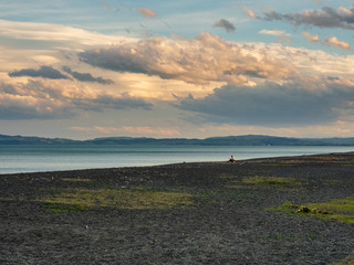 lone person on beach at sunset