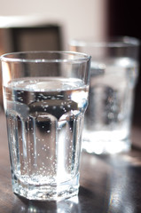 Glass with mineral water on the table