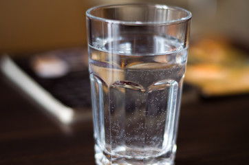 Glass with mineral water on the table