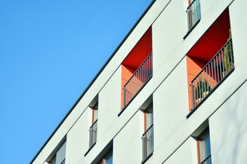 Modern apartment buildings on a sunny day with a blue sky. Facade of a modern apartment building