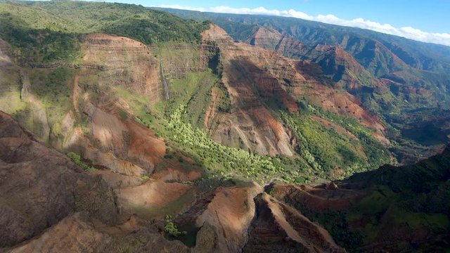 Helicopter tour of the Waimea canyon on Na Pali coast in Hawaiian island of Kauai