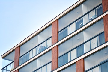 Modern apartment buildings on a sunny day with a blue sky. Facade of a modern apartment building
