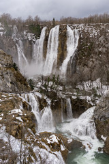 Fototapeta na wymiar Vertical picture of the big waterfall in the Plitvice National Park in Croatia