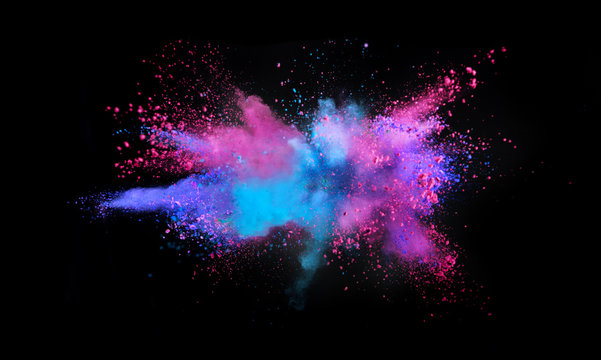 Multi colored powder explosion isolated on black