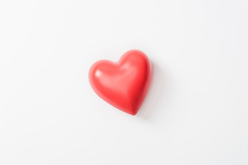 Top view of toy heart on grey background