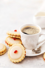 Empire shortbread sandwich cookies and cup of coffee