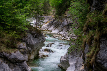 Fototapeta na wymiar Beautiful mountain stream cascading through a gorge