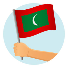 Maldives flag in hand