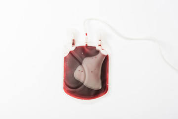 Top view of drip with blood isolated on white, blood donation concept