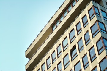 Modern apartment buildings on a sunny day with a blue sky. Facade of a modern apartment building