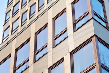 Modern apartment buildings on a sunny day with a blue sky. Facade of a modern apartment building