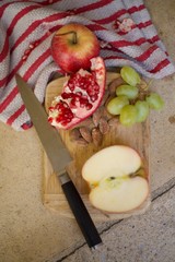 sliced red apple on a chopping board