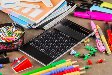 Naklejka premium Back to school. School subjects for study, rotate on the table.