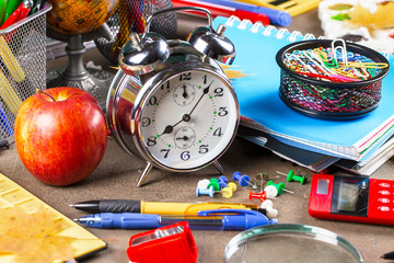 Back to school. Items for school activities rotate on the table.