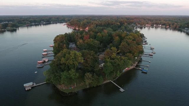 Aerial vacation house at sunset on the shores of fresh water lake, MI, USA