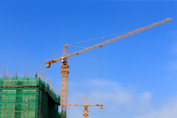 The crane is at work, at the construction site