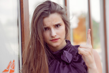 woman wagging her finger isolated outside